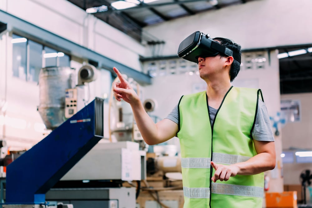 Industrial Factory Worker Wearing VR Goggle Touching in Virtual