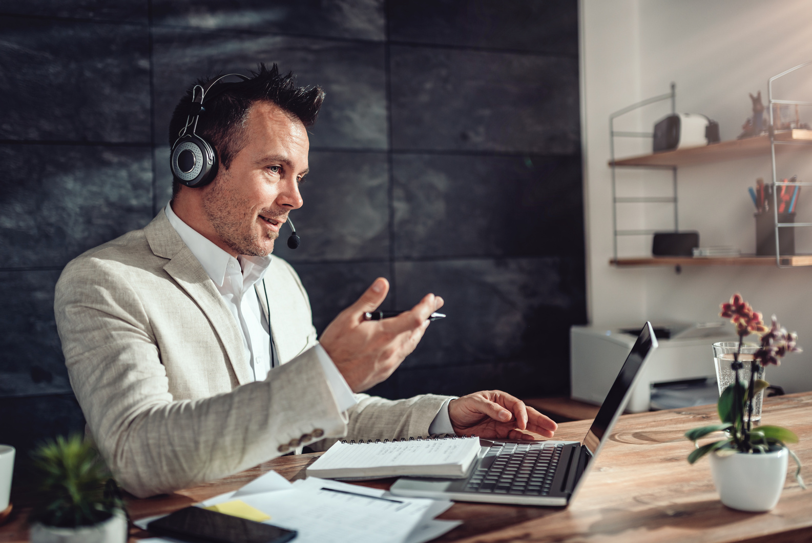 Businessman having online meeting in his office